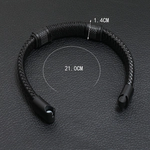 Detail view of 21cm black braided leather bracelet with magnetic cylinder clasps