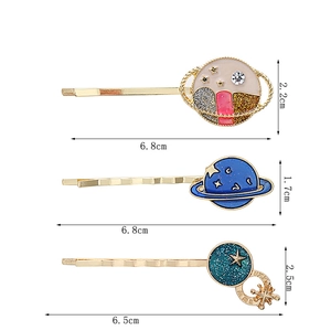 Detailed view of enamel planet hair clips with dimensions 6.8cm and rhinestones