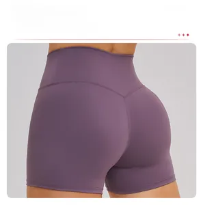 Detailed back view of purple cross-waist yoga shorts showing V-shaped butt-lifting seams