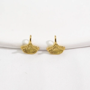 Polished 14K gold stainless steel ginkgo leaf pendants with detailed metal texture