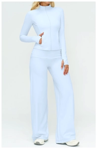 Detail of light blue sports jacket with zipper, thumb holes and high waist wide leg pants