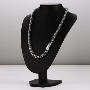 Sleek 8mm silver stainless steel woven chain necklace on a black professional bust display