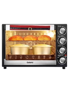 Close-up of festive red Christmas handle covers with gold buckle on a kitchen oven door