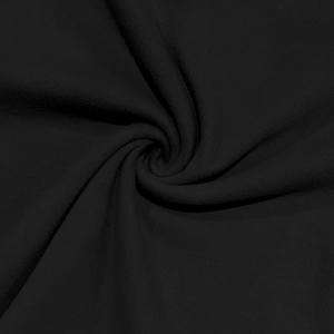 Close-up of soft black velvet thermal fabric showing smooth spiral texture and drape