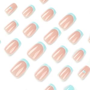 Blue and white French press-on nails with heart patterns and square oval shape
