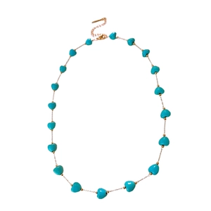 Chic turquoise heart bead necklace with adjustable metal chain on a clean white background