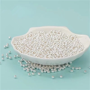 Macro shot of polished S999 sterling silver loose beads for DIY jewelry making