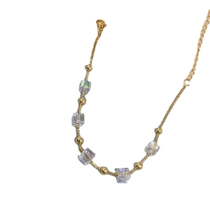 Titanium steel bracelet featuring color-changing sugar cube crystals and gold beads