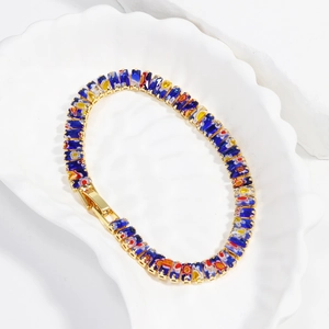 Detail of colorful rectangular millefiori glass stones on a gold alloy bracelet