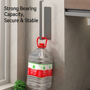 Gunmetal wall-mounted kitchen rack showing high load-bearing capacity on stone wall