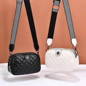 Quilted crossbody bags in black and white with striped wide straps for stylish women
