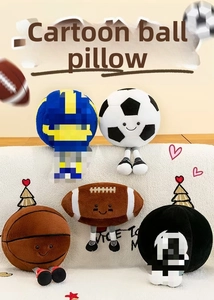 Detailed view of creative plush sports balls with faces and legs on a white sofa