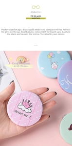 Close-up of pink PU leather pocket mirror with crown pattern and metal flip folding hinge