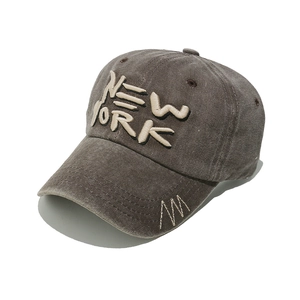 Detail of vintage coffee baseball cap featuring NEW YORK embroidery and side stitching