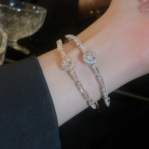 Elegant silver open bangle with pavé-set zircons and double-ring geometric design