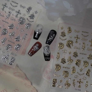 Detail of 3D metallic moon and star nail stickers with gothic knight and cross motifs