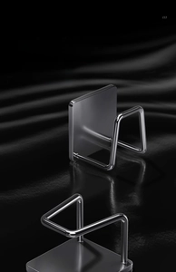 Detail of gunmetal grey stainless steel hooks for lids and cutting boards with mirror finish