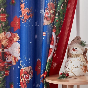 Detail of Christmas themed printed curtain featuring Santa and reindeer on blackout fabric