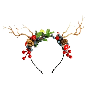 Christmas reindeer antler headband with pine cones and red berries on white background
