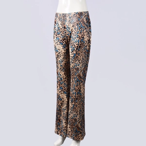 Detail shot of the elastic high waist leopard print flared trousers in brown and blue