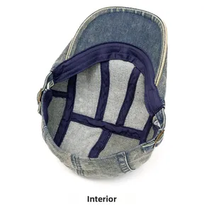 Detail view of washed denim hat interior with reinforced navy straps and metal buckle
