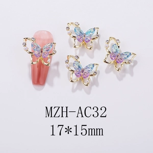Detailed view of Aurora resin butterfly nail art charm with gold alloy and small pearls