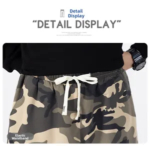 Close-up of camouflage cargo pants featuring an elastic waistband with a white drawstring