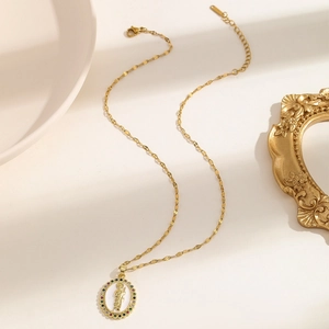 Elegant gold necklace with multi-colored zircon stones and oval religious icon pendant