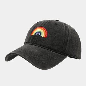 Detailed view of rainbow bridge embroidery on washed charcoal cotton baseball cap