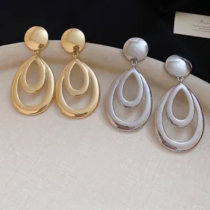 Boucles d'oreilles géométriques goutte d'eau creuse en finitions or et argent