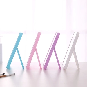 Portable square desktop makeup mirror with adjustable folding stand in four soft colors