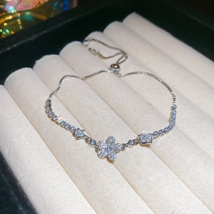 Detailed macro view of adjustable silver flower bracelet with sparkling zircon stones