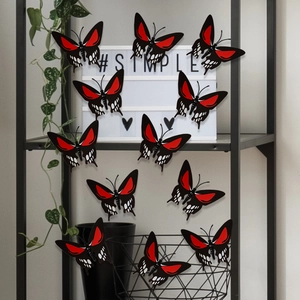Detailed view of 3D black and red skull rose butterfly stickers for wall decoration