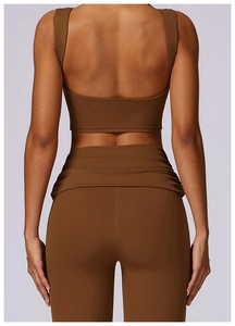 Detail view of chocolate brown racerback yoga vest and high-waisted lifting leggings