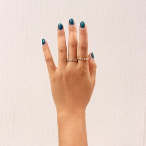 Detail view of 18K gold plated stainless steel rings set with cubic zirconia on hand