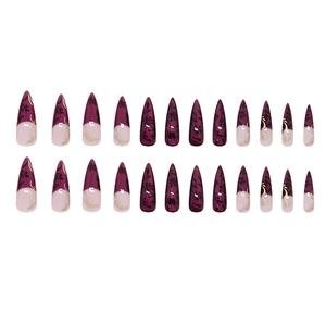 Press on nails set with purple and pink stiletto tips featuring black floral lace patterns