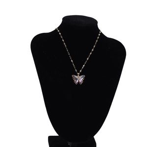 Elegant 18k gold plated necklace with purple gradient crystal butterfly pendant on black stand
