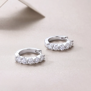 S925 sterling silver hoop earrings with five round moissanite stones in a minimalist design