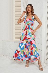Detail of colorful abstract print dress featuring multi-layered tiered skirt and tie straps
