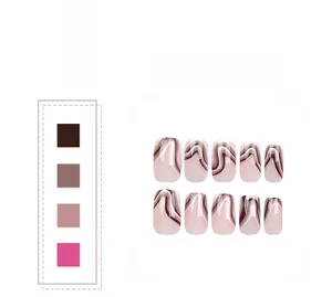 Close-up of pink press-on nails featuring red and white wavy line patterns and textures