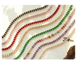 Macro shot of colorful oval gemstone bracelets with gold plating in assorted colors