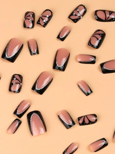 Press on nails with black French tips, butterfly wings design and rhinestones decoration