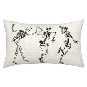 Detailed close-up of beige linen Halloween pillow cover featuring three dancing skeletons