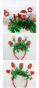 Close-up of Christmas headbands with reindeer, gingerbread man, and gnome decorations