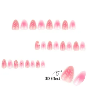 3D floral pink gradient almond press-on nails with embossed flowers and pearl accents