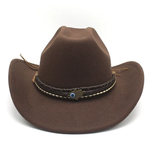 Detail of brown wool cowboy hat with braided band and evil eye hand charm