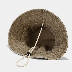 Outdoor sun hat with wide brim in washed khaki canvas and adjustable chin strap