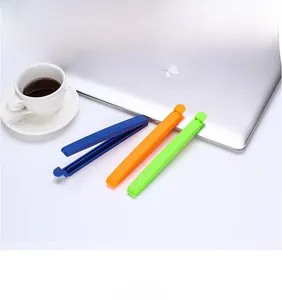 Three colorful plastic sealing clips for food bags shown with high durability hinges