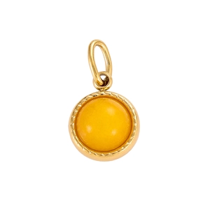 Macro shot of elegant round yellow gemstone pendant with gold-plated metal frame