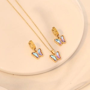 Fashion butterfly jewelry set with iridescent purple heart necklace and gold earrings